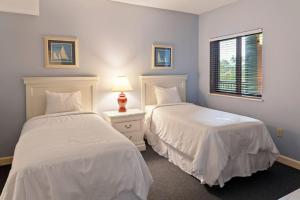 Voodi või voodid majutusasutuse Waterside at Spinnaker Resorts toas