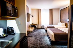 Voodi või voodid majutusasutuse AX Hotel toas