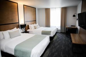 Voodi või voodid majutusasutuse AX Hotel toas