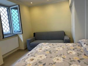 Ένα ή περισσότερα κρεβάτια σε δωμάτιο στο Casa Sermoneta