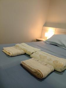 two white towels are laying on a bed at S4 Hotel SUÍTE 1120 in Brasilia +17 photos