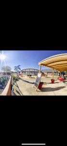 a building with a sign in front of a park at Mobilhome in Litteau