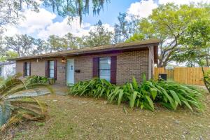 a brick house with a white door at Happy Palette Home Close to downtown Fenced yard in Sanford