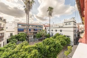 an overhead view of a building with palm trees at Green House in Seville