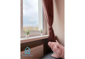 a window in a room with a radiator and a window at Piggy Room - 3 km to Baltic Sea in Gdańsk