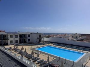 a swimming pool on the roof of a building at Rosalia28 in Antigua