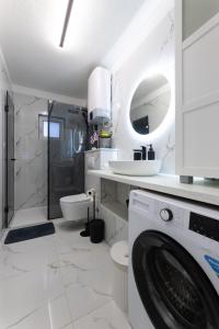 Ένα μπάνιο στο Apartment Coastal Charm