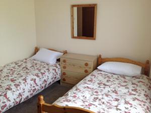 A bed or beds in a room at Stow House