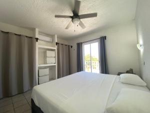 Postel nebo postele na pokoji v ubytování Caribo Cozumel + 24 fotografií