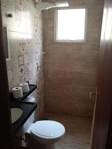 Ένα μπάνιο στο Casa com lazer até 12 pessoas