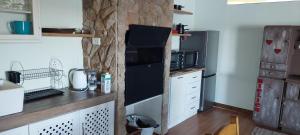 a kitchen with a black refrigerator and a counter at Geust House 4288 in Bethlehem