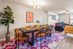 a dining room and living room with a table and chairs at Cozy 4BD - Fire Pit & BBQ - 10 Min from Downtown in Lubbock