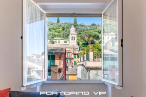 an open window with a view of a city at Cocca's House by PortofinoVip in Portofino