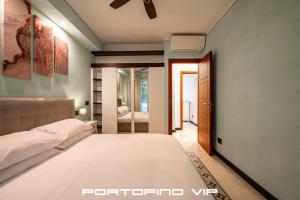 Ένα ή περισσότερα κρεβάτια σε δωμάτιο στο Portofino Flat by PortofinoVip