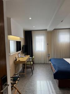 Letto o letti in una camera di Hotel Astra