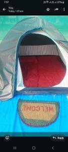 Postel nebo postele na pokoji v ubytování Honnavar Beach tent house stay