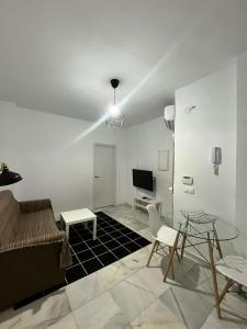 TV a/nebo společenská místnost v ubytování Premium Mármoles Apartments