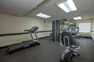 a gym with a treadmill and a exercise bike at Red Roof Inn Charlotte - University in Charlotte