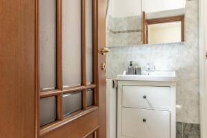 a bathroom with a sink and a mirror at Giadera penthouse 5terreparco in Riomaggiore +43 photos