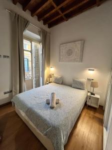Posteľ alebo postele v izbe v ubytovaní Premium Malaga Center
