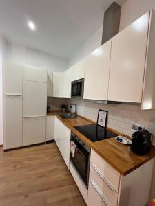 Kuchyňa alebo kuchynka v ubytovaní Premium Malaga Center + 25 fotografií