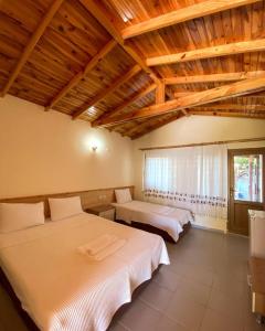 Cama ou camas em um quarto em Likya Adrasan