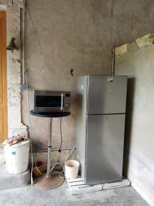 Kuchyň nebo kuchyňský kout v ubytování Ancienne école de Colombier