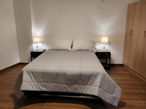 Ένα ή περισσότερα κρεβάτια σε δωμάτιο στο Venue Apartments