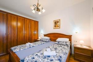 Postel nebo postele na pokoji v ubytování Apartment Emma