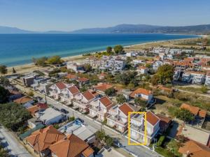 an aerial view of a town next to the ocean at Aegean dream house in Ofrínion