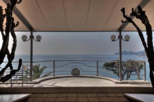 a view of the ocean from the balcony of a house at Hotel Continental in Santa Margherita Ligure