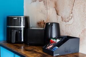 a coffee maker and a box on a counter at Open Mind Property - HotTUB, 4 Beds & 2 Free Parking in Portsmouth