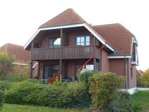 Κήπος έξω από το Kleiner Sundblick – Ferienwohnung in Lemkenhafen