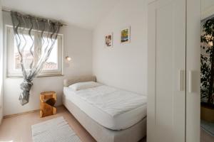 Posteľ alebo postele v izbe v ubytovaní Apartment Heart of Poreč