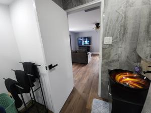 a bathroom with a tub in a room with a couch at The Lucky Nook-Comfortable Studio, Close to All in Atlantic City