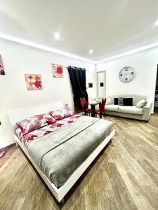 a bedroom with a bed and a living room at Casa Federica in Ventimiglia