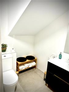 a bathroom with a toilet and a sink at Vera Holydays in Torremolinos