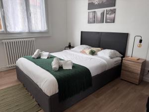 Ένα ή περισσότερα κρεβάτια σε δωμάτιο στο Grande maison centre ville - 5CH - 14 Pers