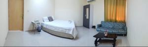 Ένα ή περισσότερα κρεβάτια σε δωμάτιο στο Guest house in New kwaitat near Al Ain Mall