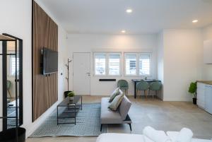 a living room with a couch and a table at Nomad Malaga - Airport II in Málaga