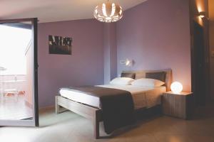 Postel nebo postele na pokoji v ubytování La Scivola Rooms