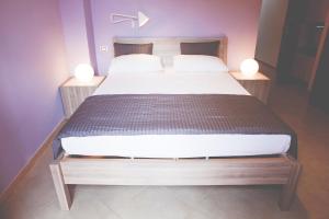 Postel nebo postele na pokoji v ubytování La Scivola Rooms