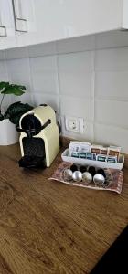 a kitchen counter with a toaster and some muffins at Los Cristianos Penthouse in Arona