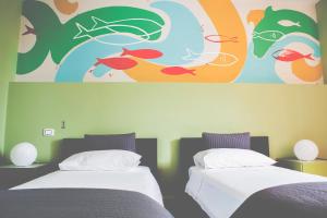 Postel nebo postele na pokoji v ubytování La Scivola Rooms