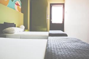 Postel nebo postele na pokoji v ubytování La Scivola Rooms