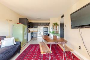 a living room with a couch and a table at 1 BD Boulder Getaway - Pets Allowed with Full Amenities in Boulder