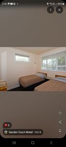 タウランガにあるGarden Court Motel & Backpackersのベッドルーム1室(ベッド2台付) +23枚の写真