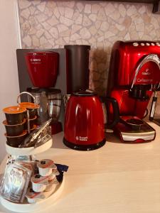 a counter with a red coffee maker and a toaster at Maiberg in Heppenheim an der Bergstrasse