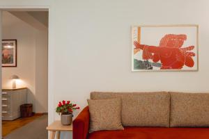 a living room with a couch and a picture on the wall at Mia Homes - Acropolis in Athens