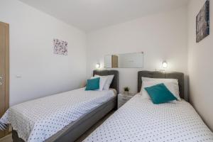 Voodi või voodid majutusasutuse Apart sa Terasom 250m od Plaže,Parking,Wi Fi,Roštilj toas